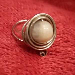 Elegant Silver Swirl Ring with Cream Stone